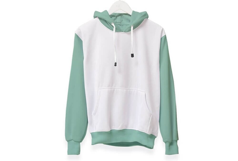 A white hoodie with light green sleeves and hood, featuring a front pocket and drawstrings, hanging on a white hanger from a rope.